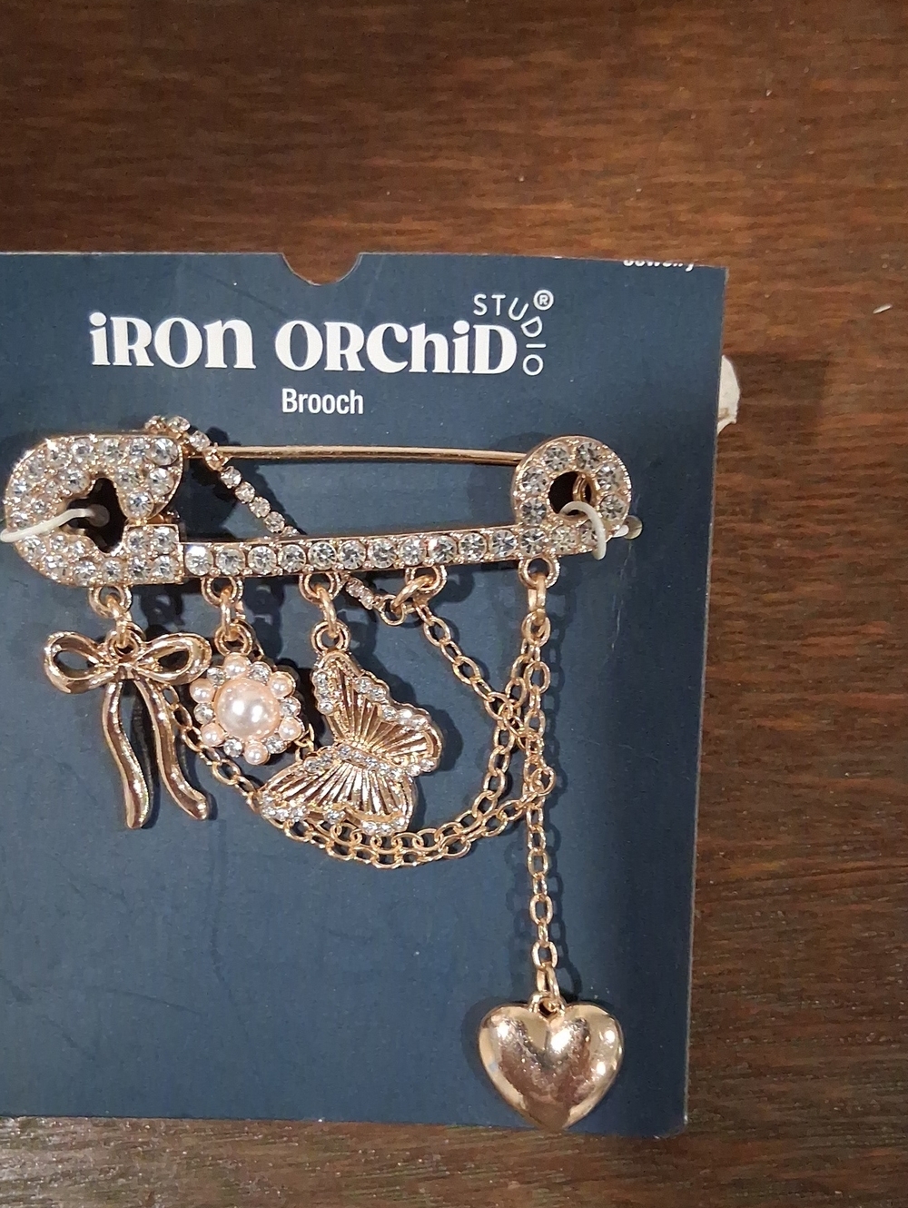 Iron Orchid Gold-Tone Crystal Charm Safety Pin Brooch